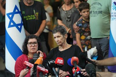 Yocheved Lifshitz speaks to television crews outside Ichilov Hospital in Tel Aviv. AFP