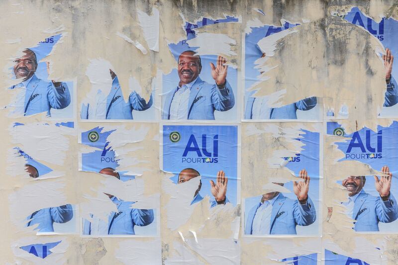 Torn campaign posters of ousted Gabon President Ali Bongo Ondimba and his political party the Gabonese Democratic Party in Libreville. AFP