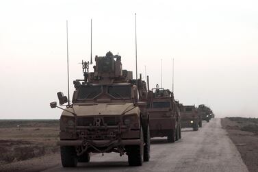 US military vehicles drive in a convoy with local allies in eastern Syria on February 21. AFP