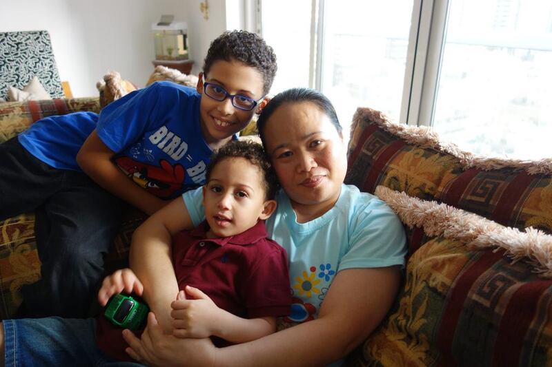 Ramile Templa has looked after Aly, 3, and Abdulrahman, 8, for several years. Delores Johnson / The National 