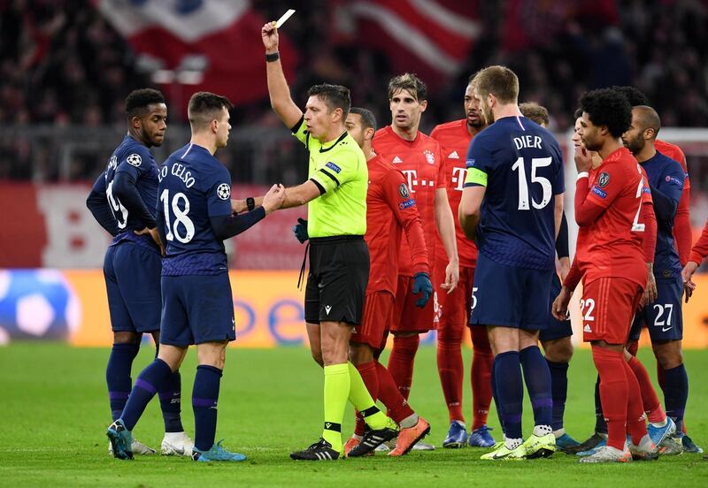 Tottenham Hotspur's Giovani Lo Celso is shown a yellow card by referee Gianluca Rocchi. Reuters