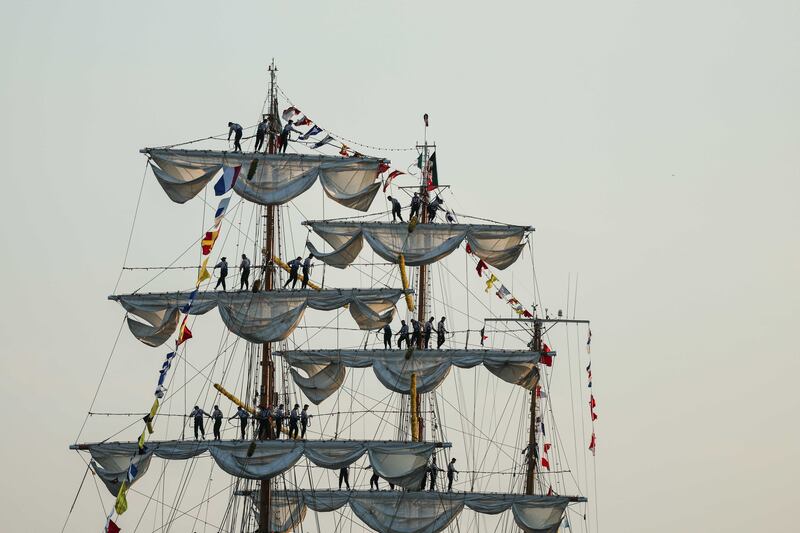 Sailors perform on a sailboat with three masts during Armada 2023, an event that gathers the most beautiful vessels in the quays of Rouen, France. EPA
