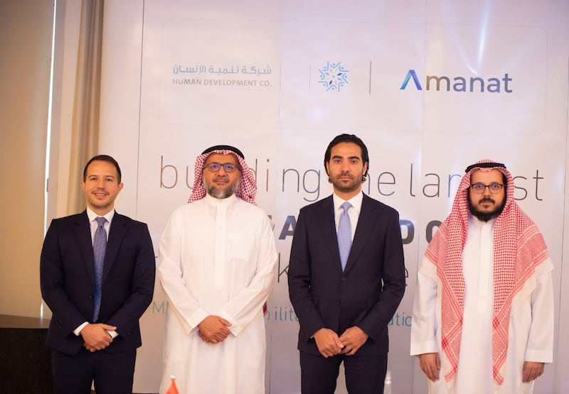 Amanat Holdings and Human Development Company executives after the signing of the deal. Photo: Amanat Holdings
