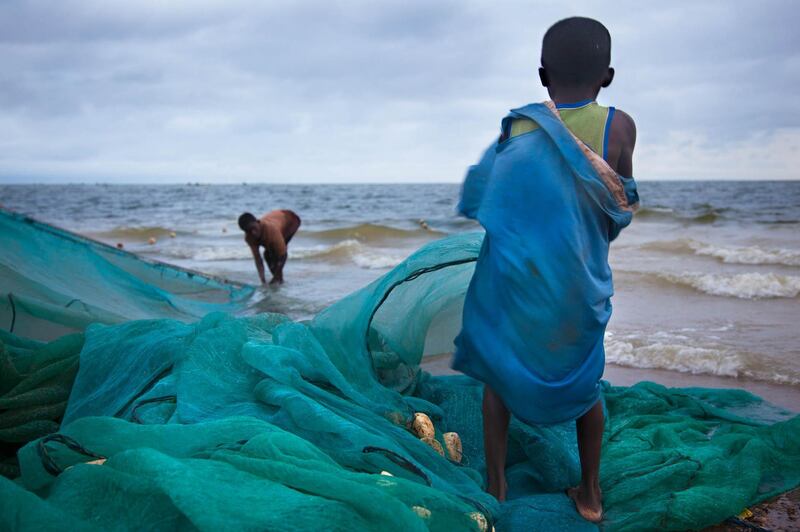 'Fishing Nets' by Lisa Kristine. The children are tasked with untangling nets that get caught underwater. Most of the children are not taught how to swim, and a number die from drowning every year.