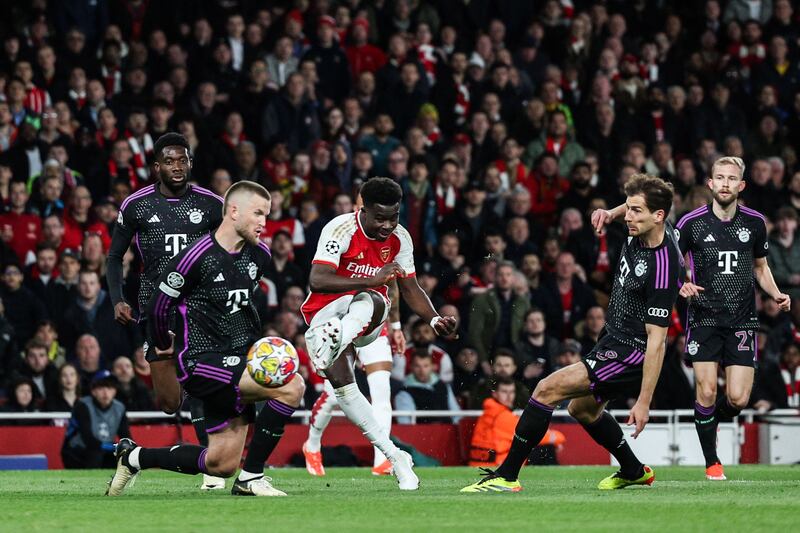Arsenal attacker Bukayo Sakascores his team's first goal. AFP