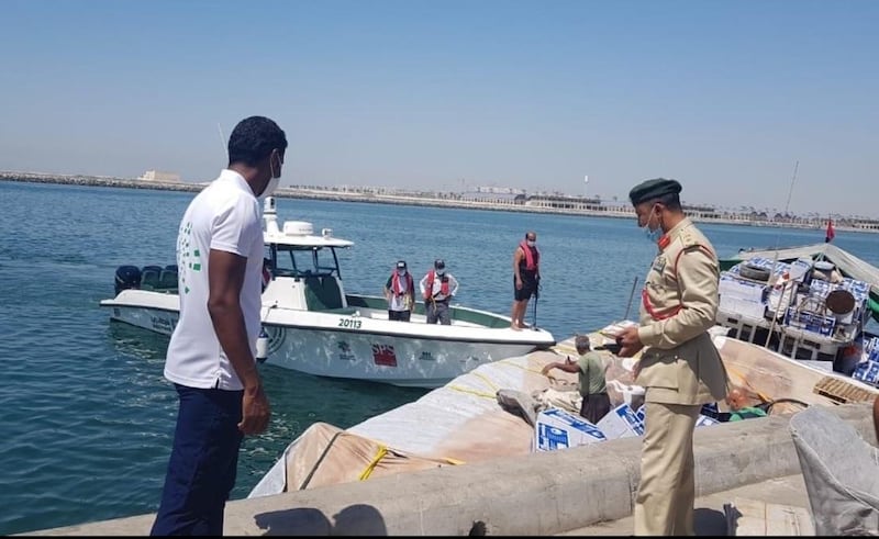 A group of sailors were brought to safety after their dhow was on the verge of sinking. Courtesy: Dubai Police