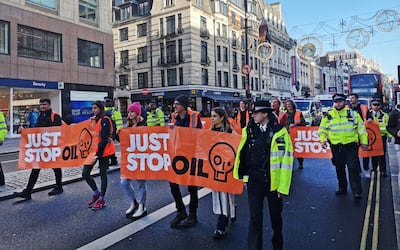 Just Stop Oil protesters block traffic in Aldwych, central London, on November 28. PA