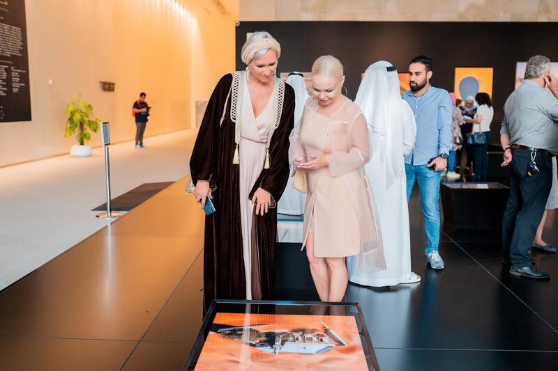 Crowds take in the new exhibit of aerial photography. Courtesy Manarat Al Saadiyat.

