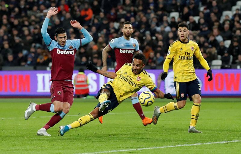 Arsenal's Pierre-Emerick Aubameyang scores their third goal. Reuters