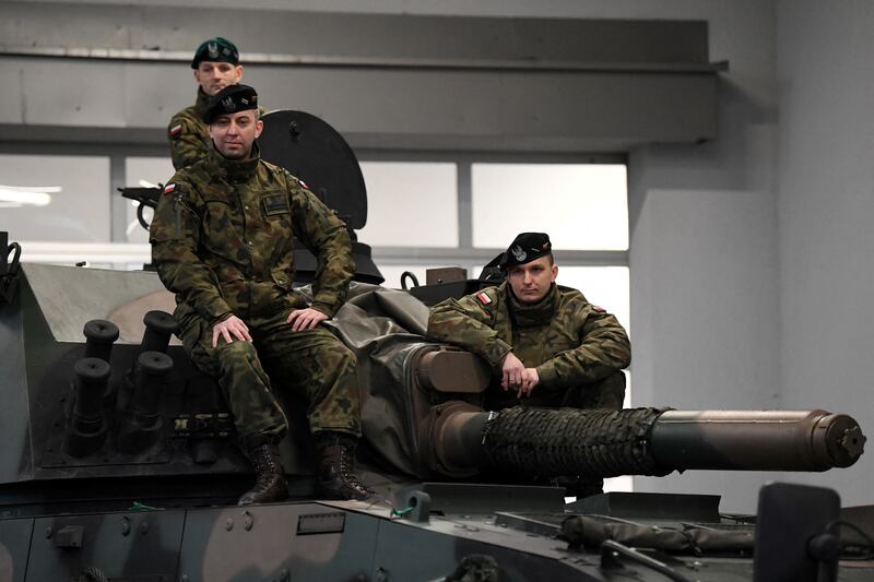 Polish troops will be backed by more military spending to deter any attack by Russia. Reuters