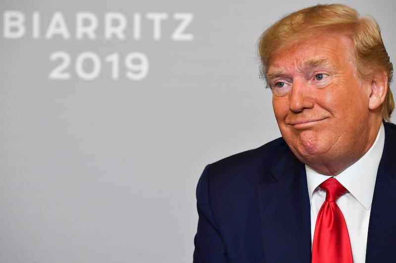 US President Donald Trump reacts during his a bilateral meeting with Egyptian President and Chairman of the African Union Abdel Fattah al-Sissi in Biarritz, south-west France on August 26, 2019, on the third day of the annual G7 Summit. / AFP / Nicholas Kamm
