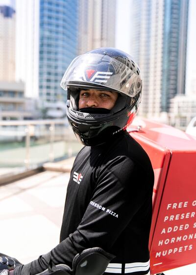 DUBAI, UNITED ARAB EMIRATES. 14 MAY 2020. 
Rakesh Kumar, bike delivery rider at Freedom Pizza
(Photo: Reem Mohammed/The National)

Reporter:
Section: