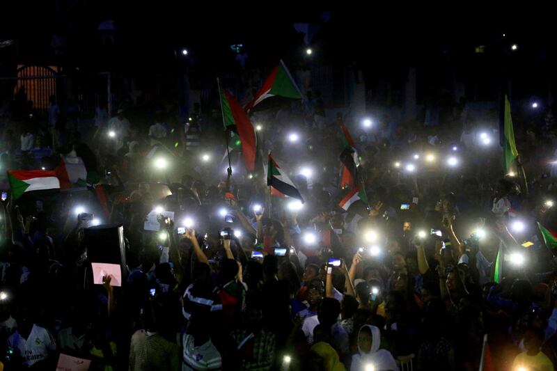 REFILE - REMOVING ERRONEOUS WORD  Sudanese protesters march during a demonstration to commemorate 40 days since the sit-in massacre in Khartoum North, Sudan July 13, 2019. REUTERS/Mohamed Nureldin Abdallah