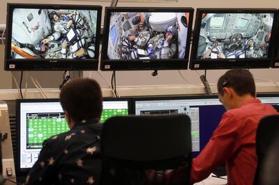 epa07803480 Members of the International Space Station (ISS) expedition 61/62, UAE astronaut Hazza Al Mansouri , Roscosmos cosmonaut Oleg Skripochka and NASA astronaut Jessica Meir are seen on screens during their final exams at the Russian cosmonaut training center in Star City outside Moscow, Russia, 30 August 2019. The launch of the mission is scheduled on 25 September 2019 from the Baikonur Cosmodrome in Kazakhstan.  EPA/MAXIM SHIPENKOV