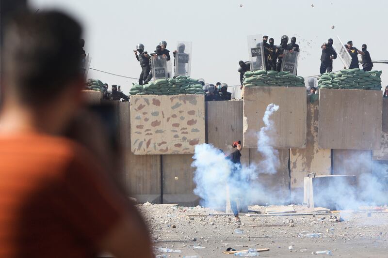 Anti-riot police clash with protesters. Reuters