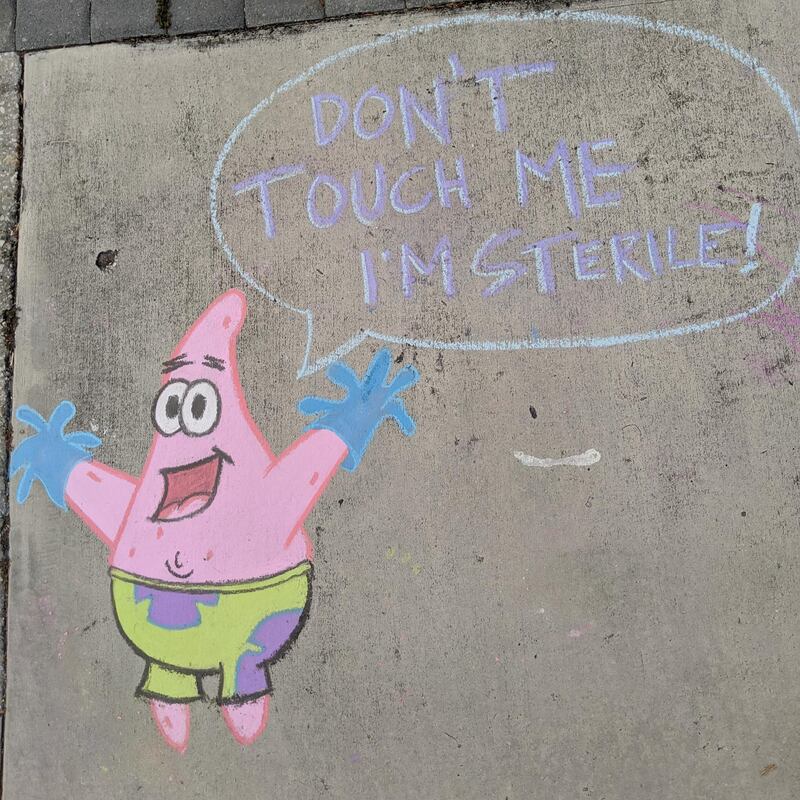 In one of Casey Drake's chalk drawings, Patrick Star from the cartoon TV series 'SpongeBob SquarePants' updates his wardrobe with a pair of medical gloves. Casey Drake