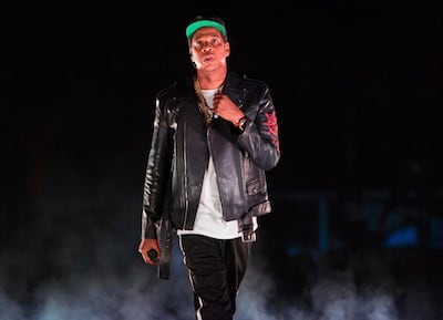 FILE - In this Nov. 26, 2017, file photo, Jay-Z performs on the 4:44 Tour at Barclays Center in New York. Woodstock co-founder Michael Lang says if he could go back in time and do things differently regarding the shambolic 50th anniversary concerts, he would. The last six months have been an extremely wild ride for Lang as he tried to make Woodstock 50 work. The first plan, to have an all-star concert with the likes of Jay-Z and more in Watkins Glen, N.Y., was scuttled after the venue pulled out. (Photo by Scott Roth/Invision/AP, File)