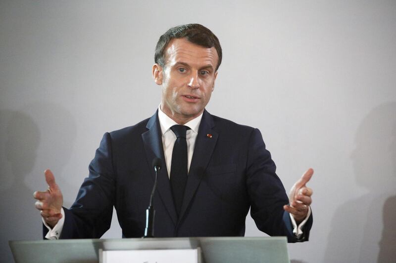 epa08085949 French President Emmanuel Macron addresses a joint news conference with Ivory Coast's President Ouattara at the Presidential Palace in Abidjan, Ivory Coast, 21 December 2019. President Macron is on a three-day official visit to Ivory Coast before visiting Niger. The visit is expected to bolster economic ties with the former colony as well as focus on security issues within the region.  EPA/LEGNAN KOULA