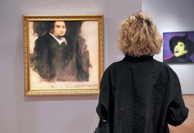 A woman looks at a work of art created by an algorithm by French collective named OBVIOUS which produces art using artificial intelligence, titled "Portrait of Edmond de Belamy" (estimate: $7,000-10,000) at Christie’s in New York on October 22, 2018. - The work of art will be included in the Prints & Multiples auction in New York October 23-25, 2018. (Photo by TIMOTHY A. CLARY / AFP) / RESTRICTED TO EDITORIAL USE - MANDATORY MENTION OF THE ARTIST UPON PUBLICATION - TO ILLUSTRATE THE EVENT AS SPECIFIED IN THE CAPTION
