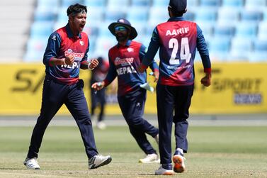 Nepal's Sandeep Lamichhane takes the wicket of UAE's Muhammad Waseem. The UAE take on Nepal in an ODI in the ICC Men's Cricket World Cup League 2. Dubai International Stadium. Chris Whiteoak / The National