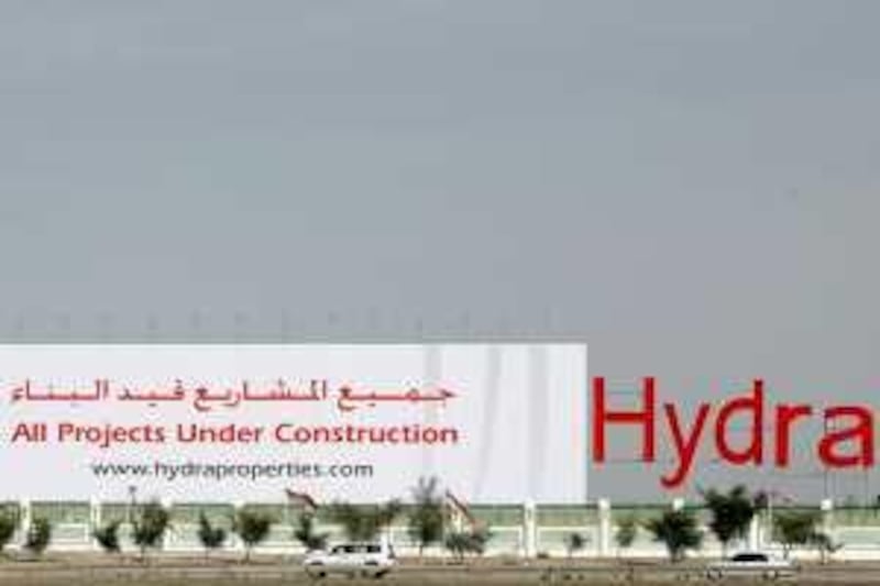 ABU DHABI, UNITED ARAB EMIRATES - March 5, 2009: A large advertisement for Hydra Village Abu Dhabi, on the edge of the construction site facing highway 11 on the way to Dubai. ( Ryan Carter / The National ) *** Local Caption ***  RC003-Hydra.JPGRC003-Hydra.JPG