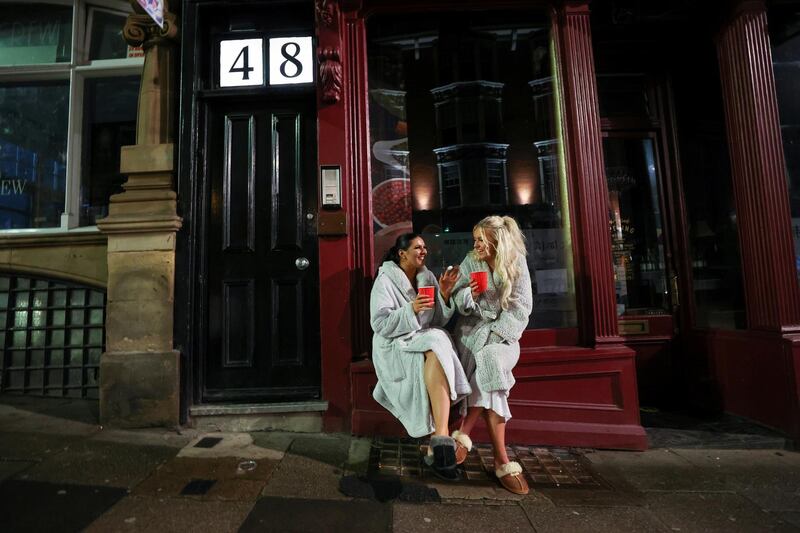 Two women celebrate the New Year in Newcastle. Reuters