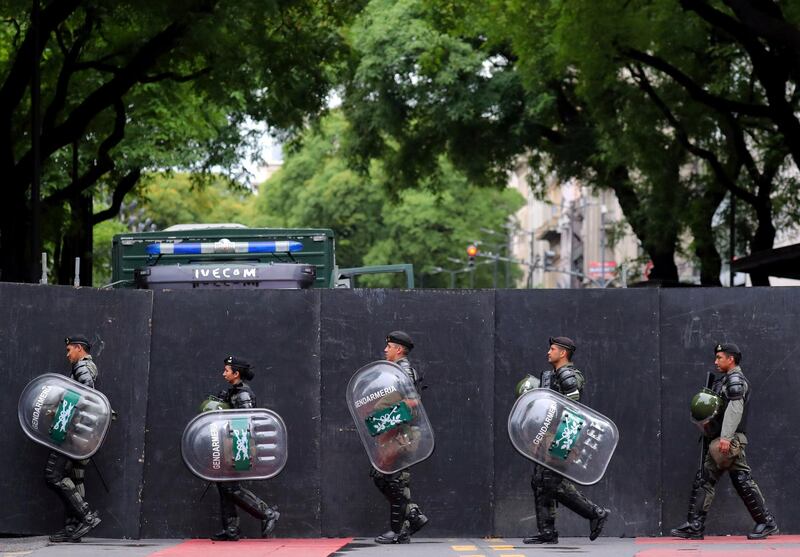 Members of Argentina's National Gendarmerie march outside a secured area in Buenos Aires, Argentina. Reuters