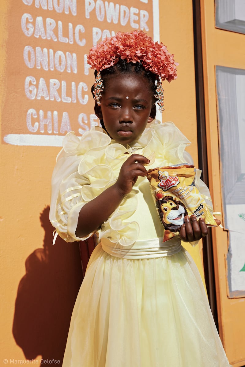 ‘Flower Girl with a Packet of Simba Chippies’ by Marguerite Oelofse (South Africa) - winner of the Pink Lady Food Photographer of the Year (African Territory)