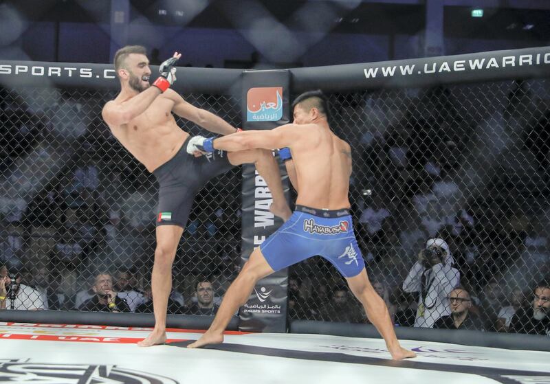 Abu Dhabi, United Arab Emirates, October 18, 2019.  UAE Warriors Fighting Championship at the Mubadala Arena.
-- (Left)Mohammed Yahya (UAE) kicks 
Glenn Ranillo (PHI) to take the win in ther lightweight division.
Victor Besa/The National
Section:  SP
Reporter:  Amith Passela