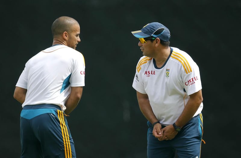 JP Duminy, left, is part of the South Africa middle-order which coach Russell Domingo, right, expects to stand up to the spinners during the upcoming series against Pakistan. Eranga Jayawardena / AP Photo