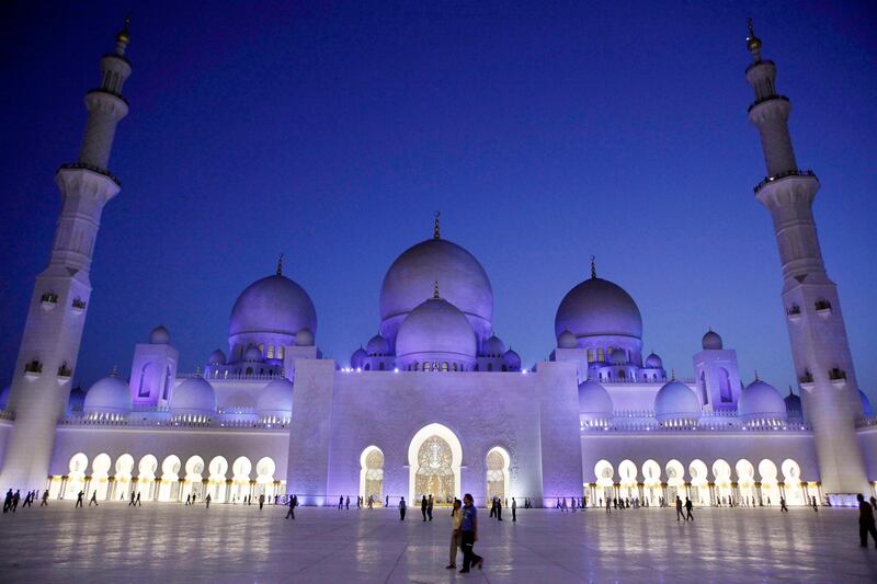 ABU DHABI, UNITED ARAB EMIRATES - August 22, 2009: Muslims make their way to evening prayer at Sheikh Zayed Grand Mosque after breaking fast at Iftar on the first day of Ramadan. 

( Ryan Carter / The National )