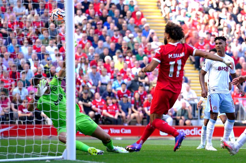 Mohamed Salah scores Liverpool's  third goal. PA