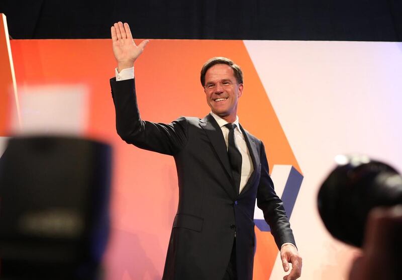 Mark Rutte, Dutch prime minister and leader of the Liberal Party (VVD), waves to supporters in The Hague, Netherlands, on Wednesday. Mr Rutte’s Liberals easily beat off an election challenge by the anti-Islam Freedom Party of Geert Wilders. Chris Ratcliffe / Bloomberg