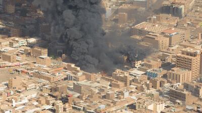 A screen grab shows black smoke and fire at a market in Omdurman, Khartoum's twin city. Reuters
