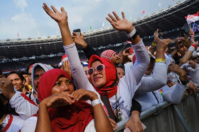 A crowd cheers at a concert and political rally for Indonesian President Joko Widodo at Jakarta's main stadium on April 13, 2019. Getty Images