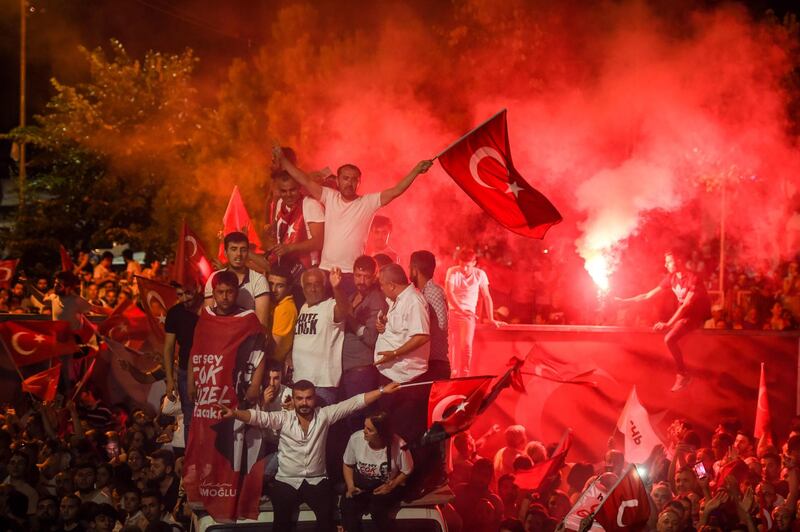 People celebrate after Binali Yildirim, who was favored by President Recep Tayyip Erdogan, conceded his defeat in the rerun of the mayoral election in Istanbul, Turkey. Burak Kara / Getty Images