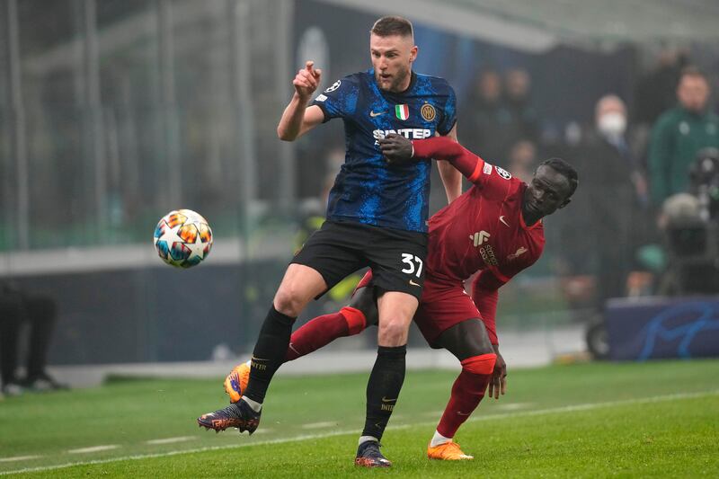 Inter's Milan Skriniar is hustled by Liverpool's Sadio Mane. AP 