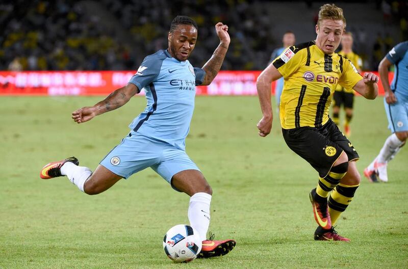 Manchester City’s Raheem Sterling controls the ball during the 2016 International Champions Cup football match between Manchester City and Borussia Dortmund in Shenzhen, south China’s Guangdong province on July 28, 2016. / AFP / WANG ZHAO