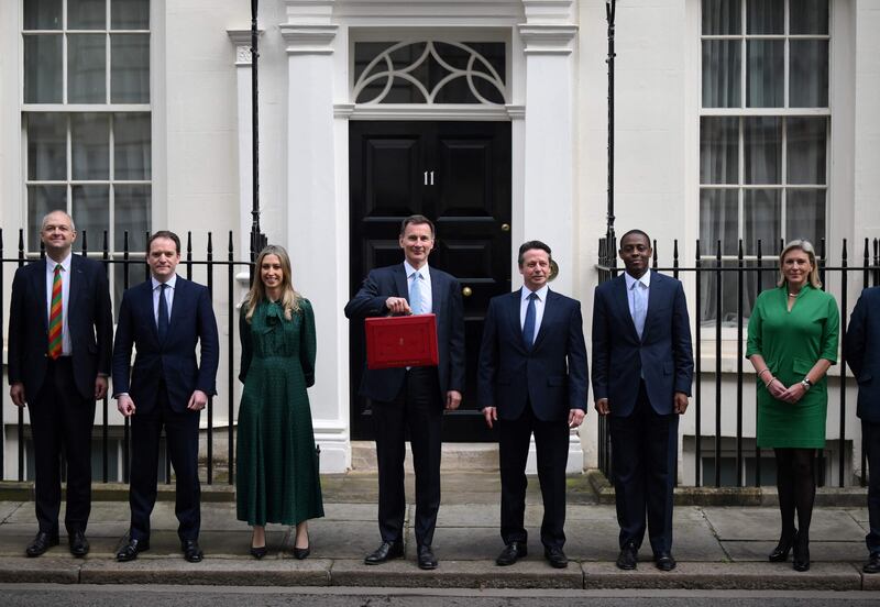 Mr Hunt with his team outside No 11 Downing Street. AFP