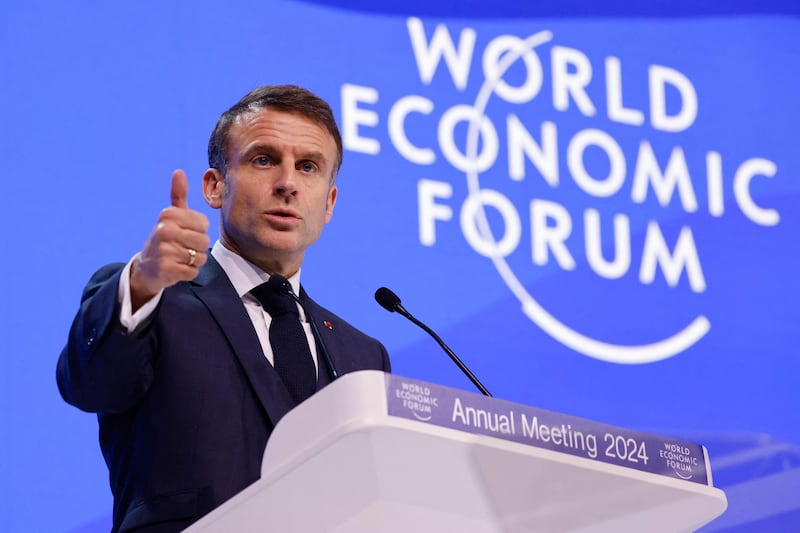 French President Emmanuel Macron urged chief executives to create jobs to strengthen society. AFP