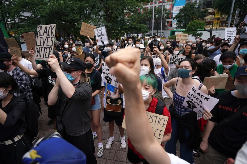 People gather to protest during a solidarity rally for the death of George Floyd Saturday in Tokyo. AP