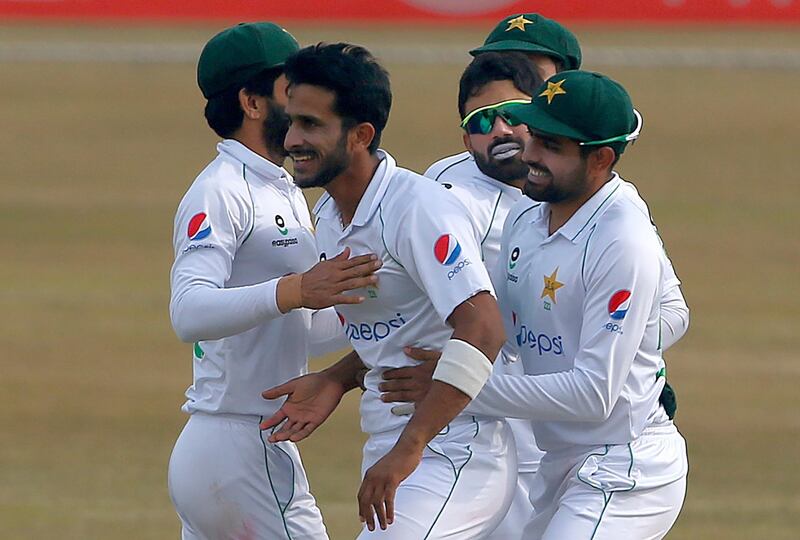 Pakistan's Hasan Ali, centre, celebrates with teammates after taking the wicket of South Africa's Faf du Plessis in Rawalpindi on Monday. AP