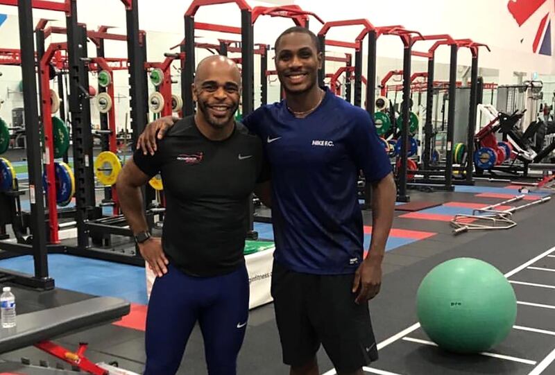 An undated handout picture shows Wayne Richardson, left, posing with Manchester United's Nigerian attacker Odion Ighalo at the National Taekwondo Centre in Manchester. AFP