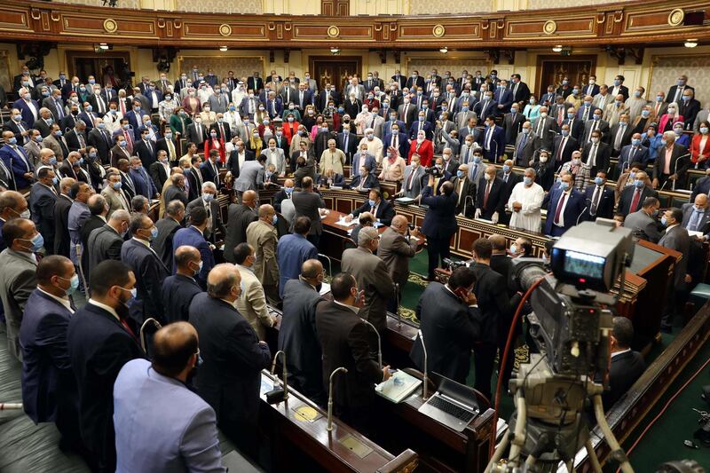 Egyptian parliament members attend a general session in the capital Cairo on July 20, 2020.      Egypt's parliament greenlighted today the possible deployment of troops in Libya to support Cairo's ally Khalifa Haftar, if rival Turkish-backed forces recapture the city of Sirte, the house said. / AFP / -
