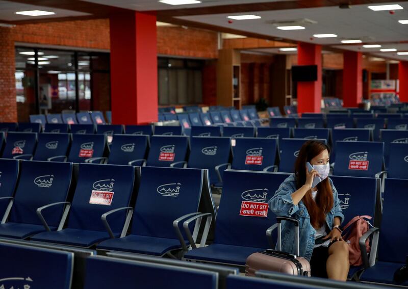 A passenger waits to board her flight at Tribhuvan International Airport after it reopened with limited international flights in Kathmandu, Nepal. Reuters