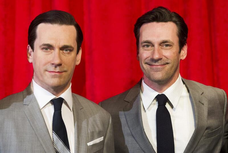 Jon Hamm, right, poses with his wax likeness at an unveiling at Madame Tussauds on Friday, May 9, 2014 in New York. AP