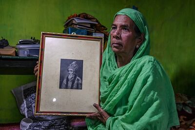 Sultana Begun holds a picture of last Mughal Emperor of India Bahadur Shah Zafar in her house in Kolkata.