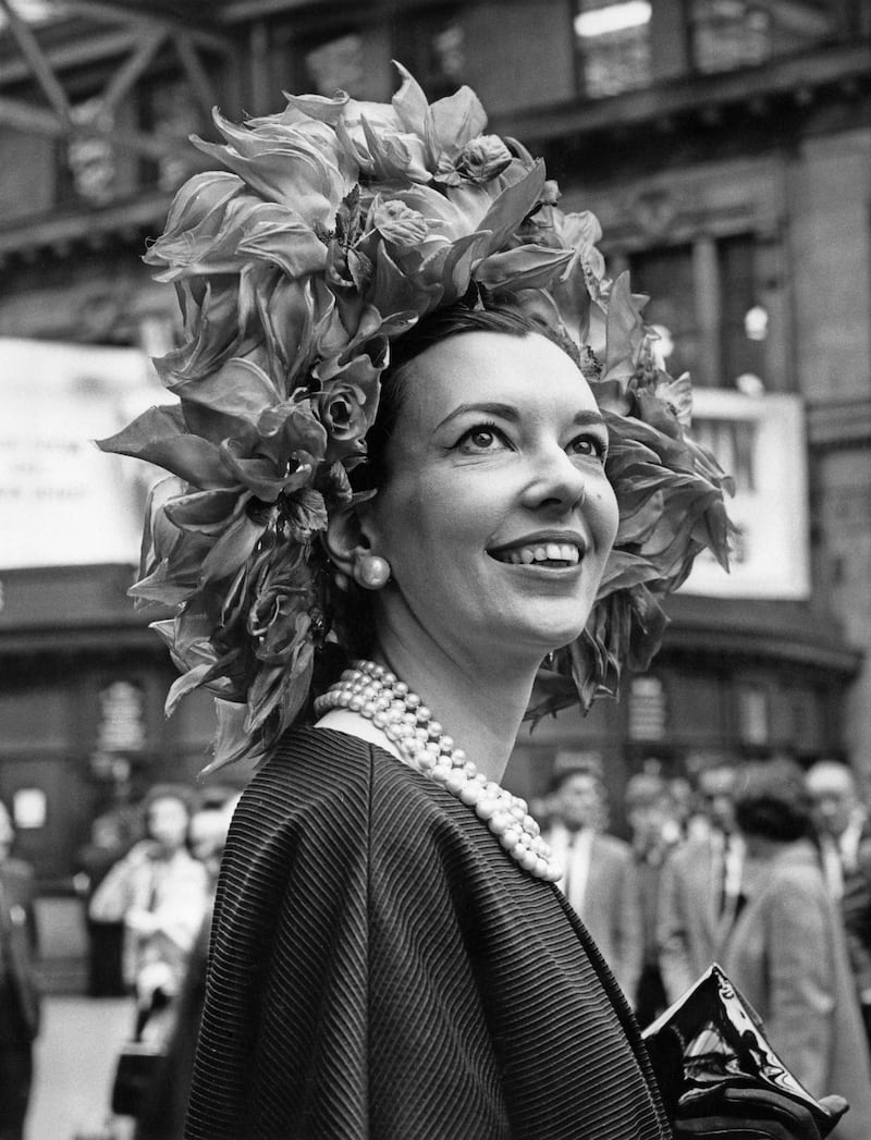 Journalist and novelist Una-Mary Parker arrived wearing a flamboyant hat decorated with red silk rose. Getty Images