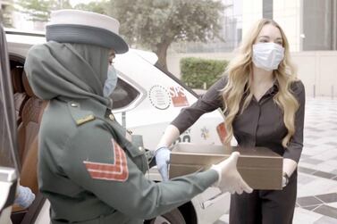 Lindsay Lohan safely covered up with gloves and a mask when she met members of Dubai Police. Instagram / Lindsay Lohan 