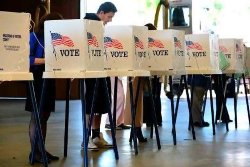 Alhambra residents vote at their local fire station in Alhambra, Los Angeles County in California. While the US presidential campaign is over, the biggest battles may be yet to come.